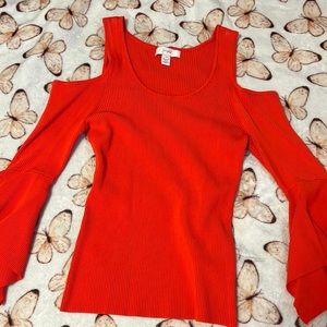 scripted red-orange shirt.